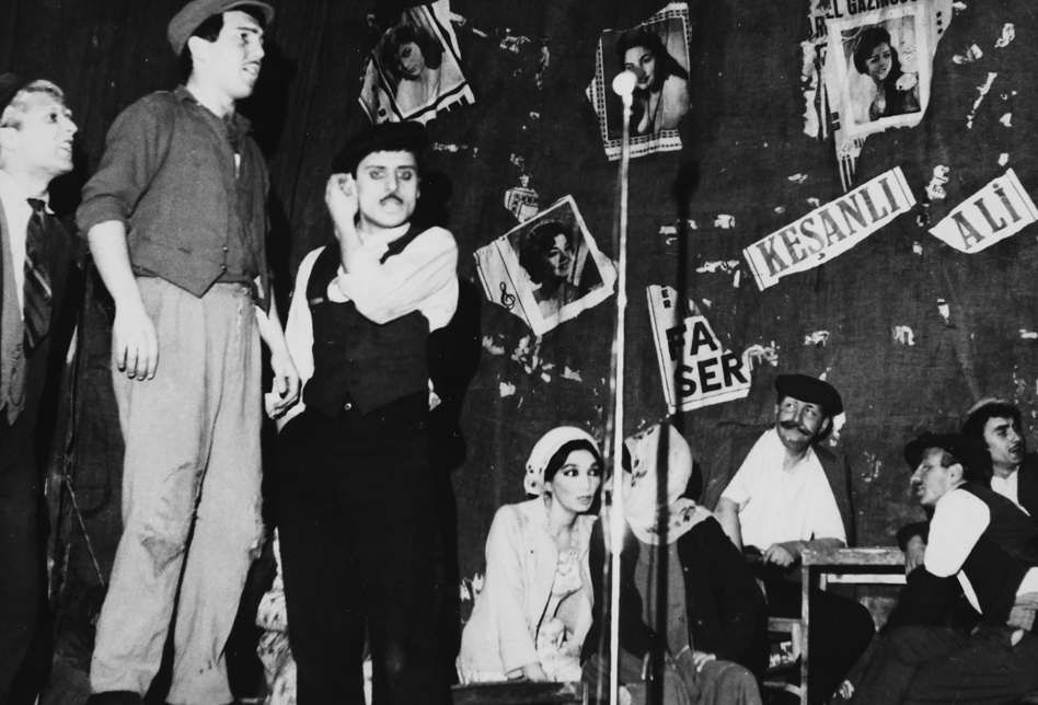 In the Play of Keşanlı Ali. Haldun Taner played a painter character just for one time(sitting by the wall with moustache)